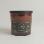 
                    
                      Vela aromática Home Collection en recipiente marrón con tapa negra-
                    
                  