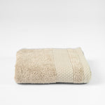 
                    
                      Toalla de algodón beige con diseño honeycomb texturizado-beige
                    
                  
