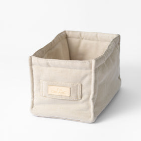 Caja organizadora de tela beige con etiqueta orgánica incorporada-