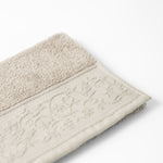 
                    
                      Toalla Malva beige texturizada con borde decorativo tejido-
                    
                  