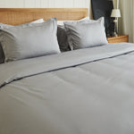 
                    
                      Cama con funda edredón gris bambú algodón y almohadas blancas-gris
                    
                  