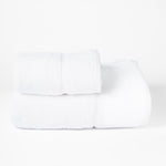 
                    
                      Set de toallas blancas Supreme enrolladas y apiladas-blanco
                    
                  