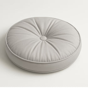 Almohada redonda gris claro con diseño capitoné y botón central-gris
