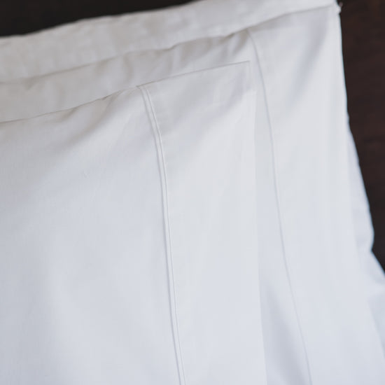 Funda de almohada blanca de algodón con costura visible en color blanco-blanco