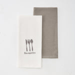 
                    
                      Dos repasadores de cocina, uno blanco con cubiertos y "Bon appétite", otro gris-gris
                    
                  